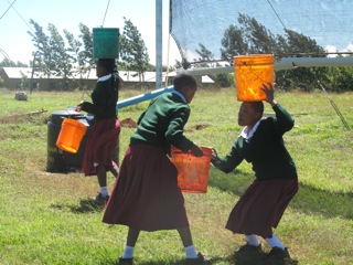 Tanzanian girls fetching fog water
